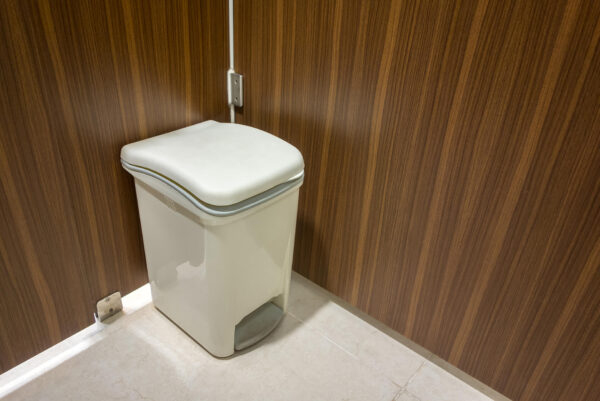 close up of sanitary disposal unit in bathroom cubicle